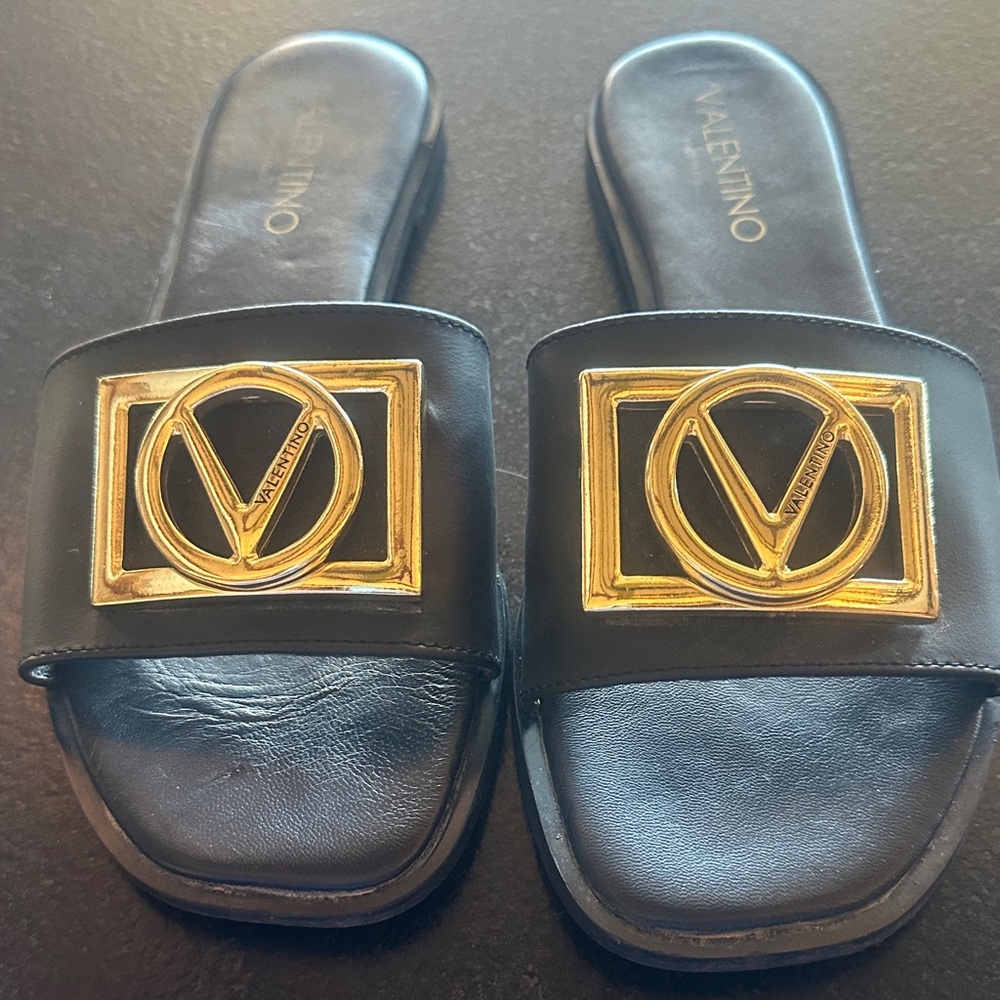 Valentino Black Leather Slides with Gold V Logo Plaque